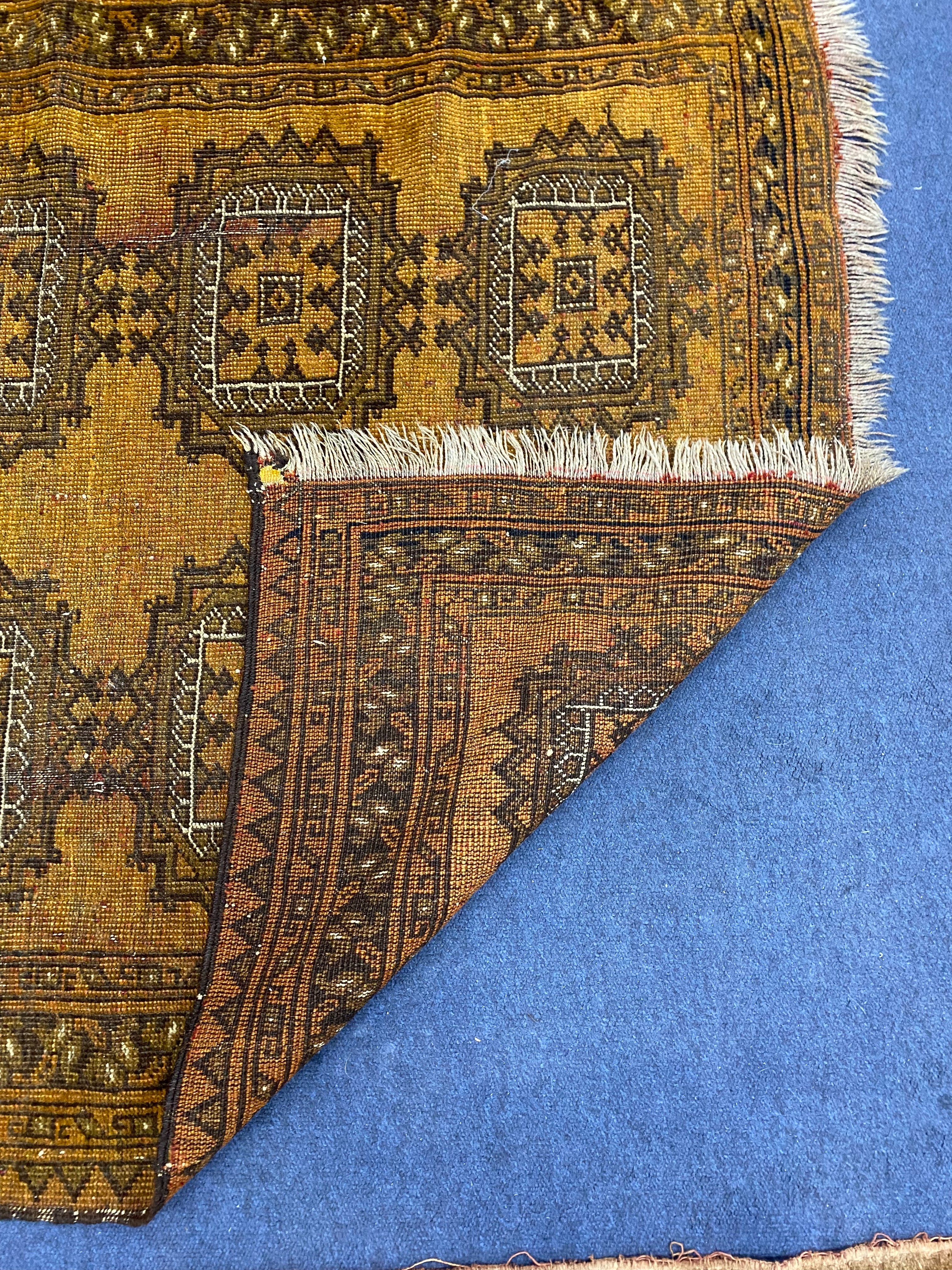 A Bokhara design mustard ground rug, 120 x 103cm together with another rug
